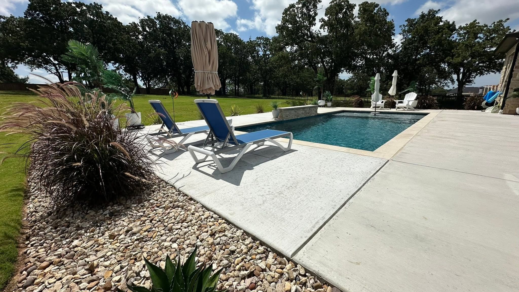 Covered outdoor living area finished beside the pool