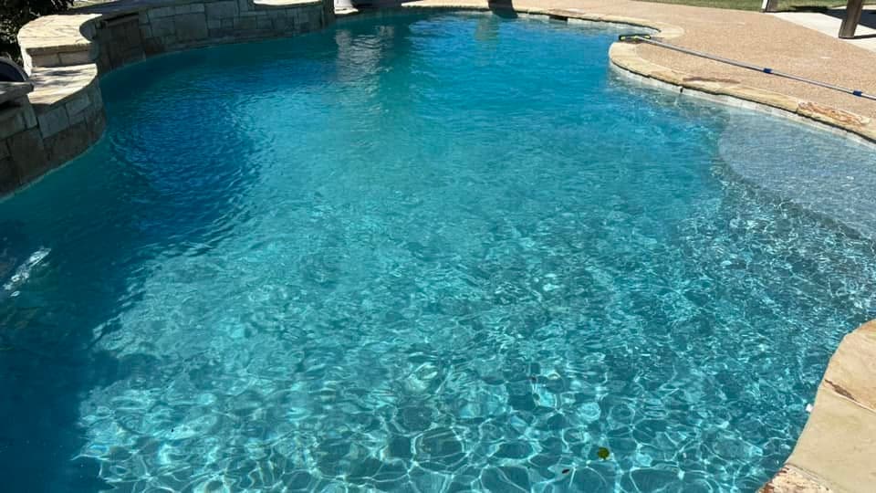 Sunlight moving across clear blue pool water