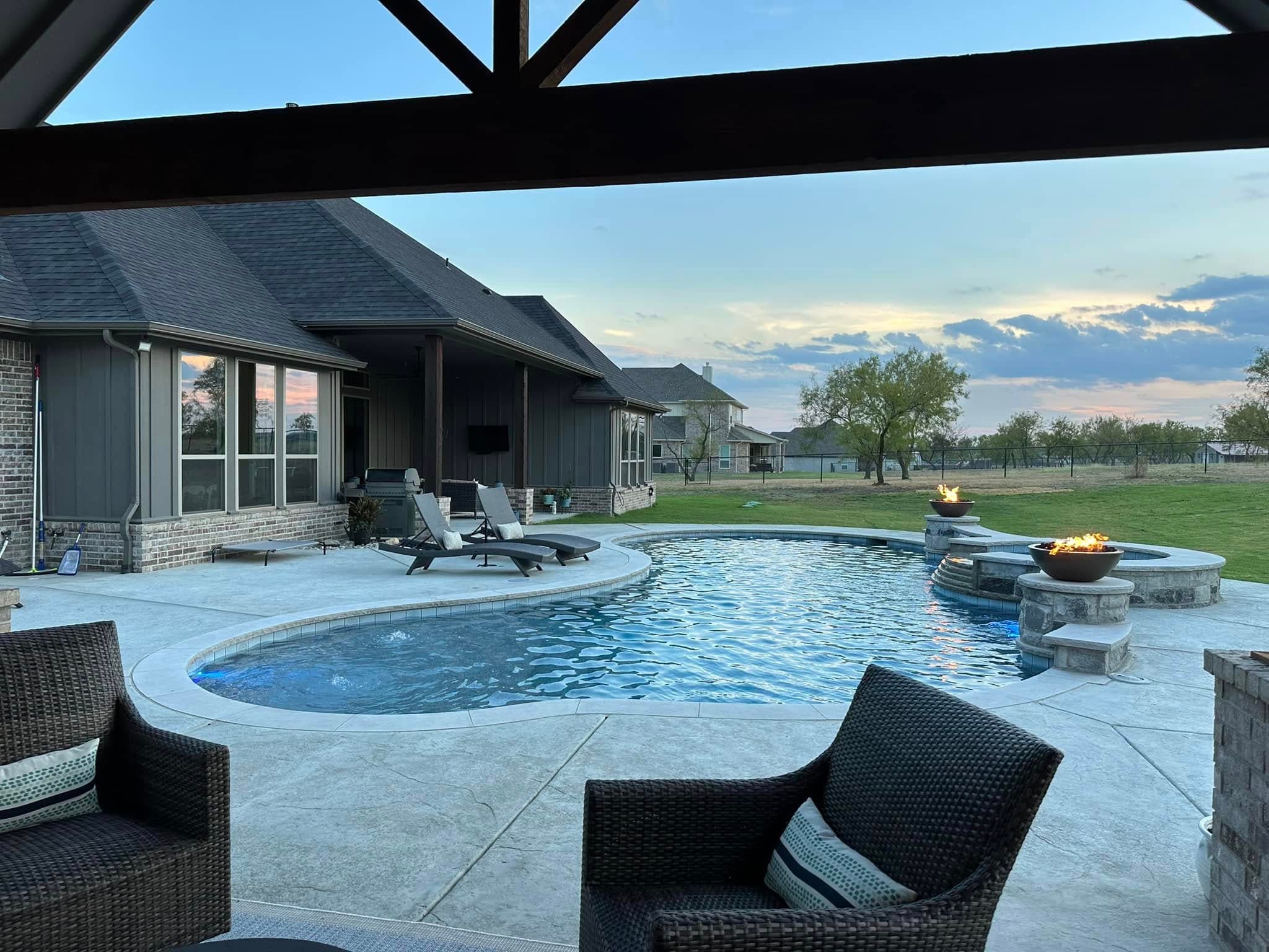 Completed pool and spa viewed from a covered patio