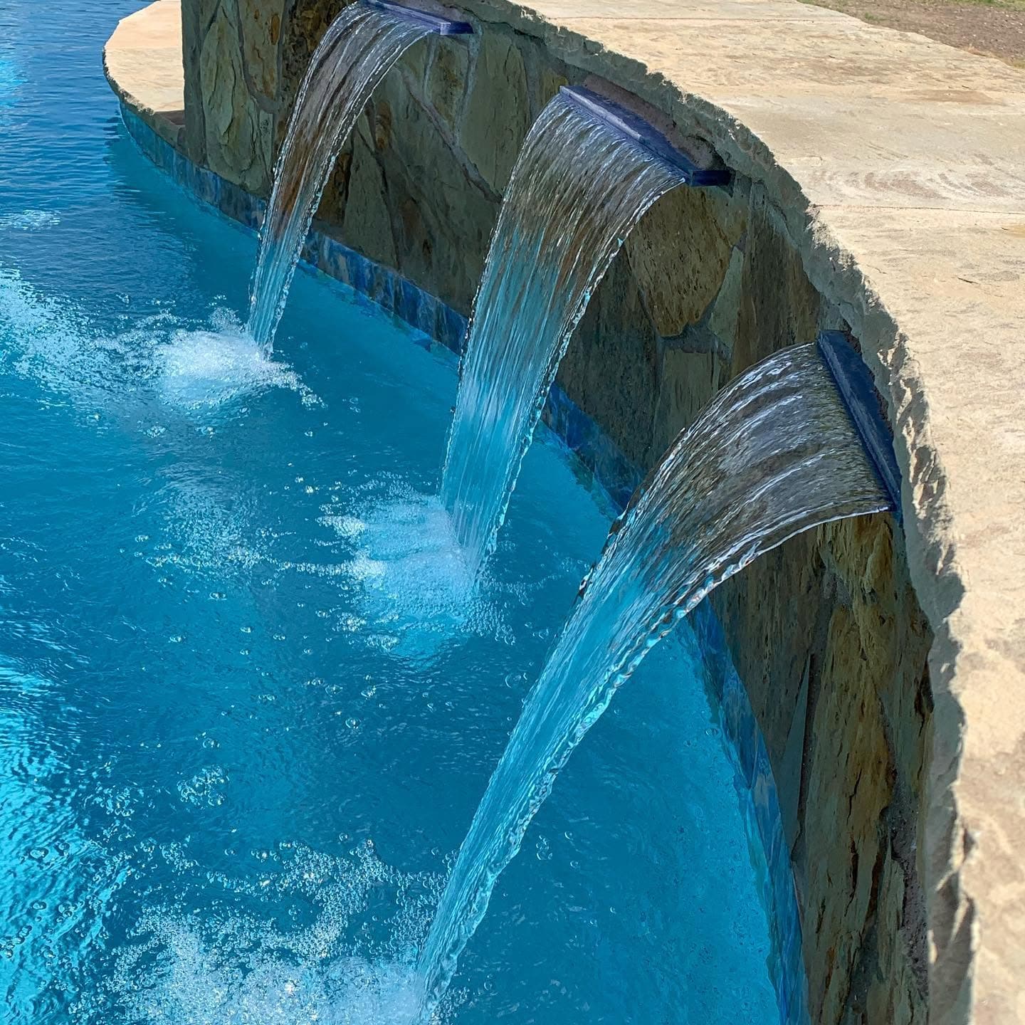 Close view of a decorative pool water feature